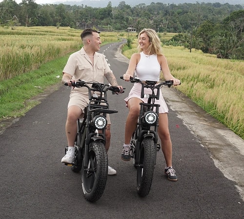 Person riding an electric bike through Bali streets